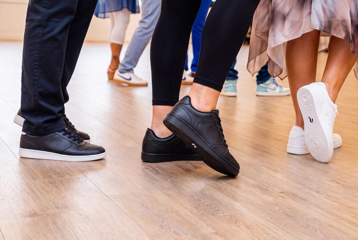 Dancers in a line dance class wearing Pulse Dance Shoes dance sneakers
